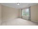 Bright bedroom with neutral walls, carpet, and a window with colorful curtains at 1028 Harpers Ridge Ct, Wake Forest, NC 27587