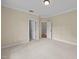 Spacious bedroom featuring neutral walls, carpet, and multiple doorways at 1028 Harpers Ridge Ct, Wake Forest, NC 27587