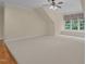Large bonus room with a ceiling fan, carpet, and natural light from a large window at 1028 Harpers Ridge Ct, Wake Forest, NC 27587