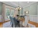Elegant dining room with large windows and stylish decor for memorable dining experiences at 1028 Harpers Ridge Ct, Wake Forest, NC 27587