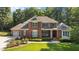 Beautiful brick home with professional landscaping and a three car garage at 1028 Harpers Ridge Ct, Wake Forest, NC 27587