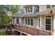 Exterior view of deck overlooking wooded backyard and showcasing neutral paint at 1028 Harpers Ridge Ct, Wake Forest, NC 27587