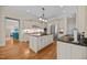 Spacious kitchen features granite countertops, stainless steel appliances and a large island at 1028 Harpers Ridge Ct, Wake Forest, NC 27587
