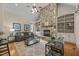 Cozy living room with vaulted ceiling, stone fireplace, and built-in shelving at 1028 Harpers Ridge Ct, Wake Forest, NC 27587