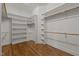 Large walk-in closet features custom shelving, hardwood flooring, and ample storage at 1028 Harpers Ridge Ct, Wake Forest, NC 27587