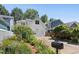 Charming home with a white exterior, an attached garage, and beautiful landscaping at 10570 Evergreen Spring Pl, Raleigh, NC 27614
