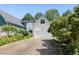 Charming home with an attached garage featuring a concrete driveway and mature landscaping at 10570 Evergreen Spring Pl, Raleigh, NC 27614