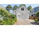 Charming home featuring a white exterior, an attached garage, and well-maintained landscaping at 10570 Evergreen Spring Pl, Raleigh, NC 27614