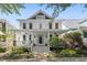 Charming two-story home featuring a welcoming front porch and beautifully landscaped front yard at 10570 Evergreen Spring Pl, Raleigh, NC 27614