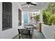 Inviting front porch with outdoor seating and a ceiling fan for a relaxing atmosphere at 10570 Evergreen Spring Pl, Raleigh, NC 27614