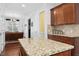 Bright kitchen featuring granite countertops, stainless steel appliances and hardwood flooring at 10570 Evergreen Spring Pl, Raleigh, NC 27614