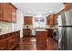 Spacious kitchen with stainless steel appliances, granite countertops, and a central island at 10570 Evergreen Spring Pl, Raleigh, NC 27614