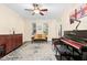 Elegant living room with hardwood floors, piano, and classic furnishings at 10570 Evergreen Spring Pl, Raleigh, NC 27614