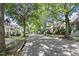 A picturesque street view with tree-lined sidewalks showcasing beautiful homes at 10570 Evergreen Spring Pl, Raleigh, NC 27614
