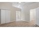 Bright room with wood-look flooring, closet, and view to ensuite bathroom at 108 Ellsworth Pl, Cary, NC 27511