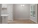Bright dining area with wood floors and a modern chandelier at 108 Ellsworth Pl, Cary, NC 27511
