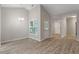 Open floor plan showing dining area with modern light fixture and wood flooring at 108 Ellsworth Pl, Cary, NC 27511