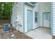 Exterior view of the rear of the home with a door and blue trim at 108 Ellsworth Pl, Cary, NC 27511