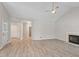 Spacious living room with new flooring, a fireplace, and high ceilings at 108 Ellsworth Pl, Cary, NC 27511