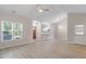 Open living space with a view of the kitchen, dining area and front door at 108 Ellsworth Pl, Cary, NC 27511