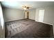 Spacious bedroom with carpet flooring, ceiling fan, and ample natural light at 1100 Birkdale Dr, Mebane, NC 27302
