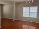 Dining room features hardwood floors, neutral wall color and large window for natural light at 1100 Birkdale Dr, Mebane, NC 27302