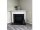 Cozy fireplace with decorative mantle adds charm to the room at 1100 Birkdale Dr, Mebane, NC 27302