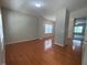 Spacious living room features hardwood flooring, neutral wall colors and lots of natural light at 1100 Birkdale Dr, Mebane, NC 27302