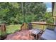 Outdoor deck with seating is perfect for entertaining and enjoying backyard views at 1104 Suterland Rd, Cary, NC 27511