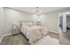 Bedroom boasts a neutral palette and ample natural light from the window at 1104 Suterland Rd, Cary, NC 27511