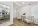 Bright foyer featuring chairs, mirror, and wood-look flooring at 1104 Suterland Rd, Cary, NC 27511