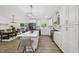 Light, bright kitchen with white cabinets, stainless steel appliances, and views to the backyard at 1104 Suterland Rd, Cary, NC 27511