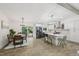 Open-concept kitchen and dining area with stainless steel appliances and island seating at 1104 Suterland Rd, Cary, NC 27511