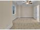Bedroom featuring a ceiling fan, neutral carpeting, trim, and walls, as well as a window and closet at 117 Finsbury St, Durham, NC 27703