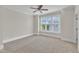 Spacious bedroom featuring plush carpet, large windows and neutral paint color at 117 Finsbury St, Durham, NC 27703