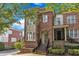 Charming brick townhouse with a welcoming entrance and well-maintained landscaping at 117 Finsbury St, Durham, NC 27703