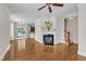 Bright living room boasting hardwood floors and a cozy fireplace, perfect for relaxing at 117 Finsbury St, Durham, NC 27703