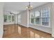 Large living room featuring hardwood floors and large windows providing ample natural light at 117 Finsbury St, Durham, NC 27703