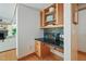Dedicated desk area with built-in storage and granite countertop at 1209 Ravens Point Cir, Raleigh, NC 27614