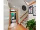 Inviting entryway with hardwood floors, staircase, and natural light, leading to a view of the outdoors at 1209 Ravens Point Cir, Raleigh, NC 27614