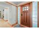 Elegant entryway featuring a beautiful wood door with glass block sidelights at 1209 Ravens Point Cir, Raleigh, NC 27614