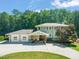 Charming two-story home with a three-car garage and welcoming front porch at 1209 Ravens Point Cir, Raleigh, NC 27614