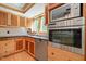 Modern kitchen with stainless steel appliances and light wood cabinetry at 1209 Ravens Point Cir, Raleigh, NC 27614