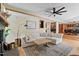 Inviting living room with fireplace, comfortable seating, and view to the bar at 1209 Ravens Point Cir, Raleigh, NC 27614