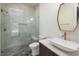 Modern bathroom featuring a glass-enclosed shower, stylish vanity, and unique vessel sink at 1212 Gunnison Pl, Raleigh, NC 27609