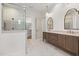 Stunning bathroom featuring double vanity, glass shower, and elegant tile flooring at 1212 Gunnison Pl, Raleigh, NC 27609