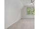 Bright bedroom featuring a neutral carpet, ceiling fan and natural light at 1212 Gunnison Pl, Raleigh, NC 27609