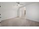 Bedroom with plush carpet, ceiling fan, white walls, and ample natural light at 1212 Gunnison Pl, Raleigh, NC 27609
