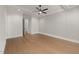 Spacious bedroom with hardwood floors, ceiling fan, and natural light at 1212 Gunnison Pl, Raleigh, NC 27609