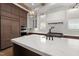 Gourmet kitchen featuring a large center island, stainless steel appliances, and custom cabinetry at 1212 Gunnison Pl, Raleigh, NC 27609